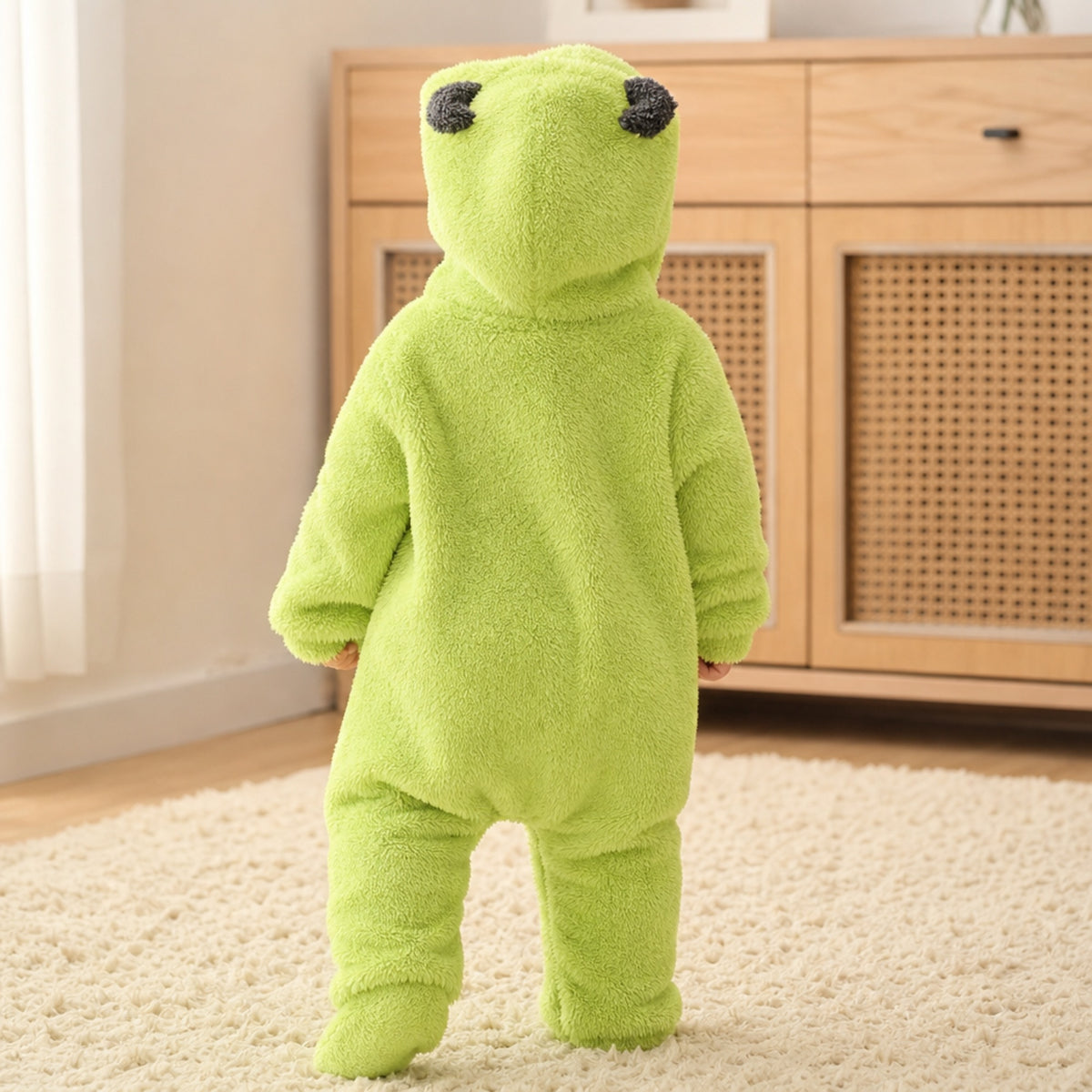 Back view of the lime green monster onesie